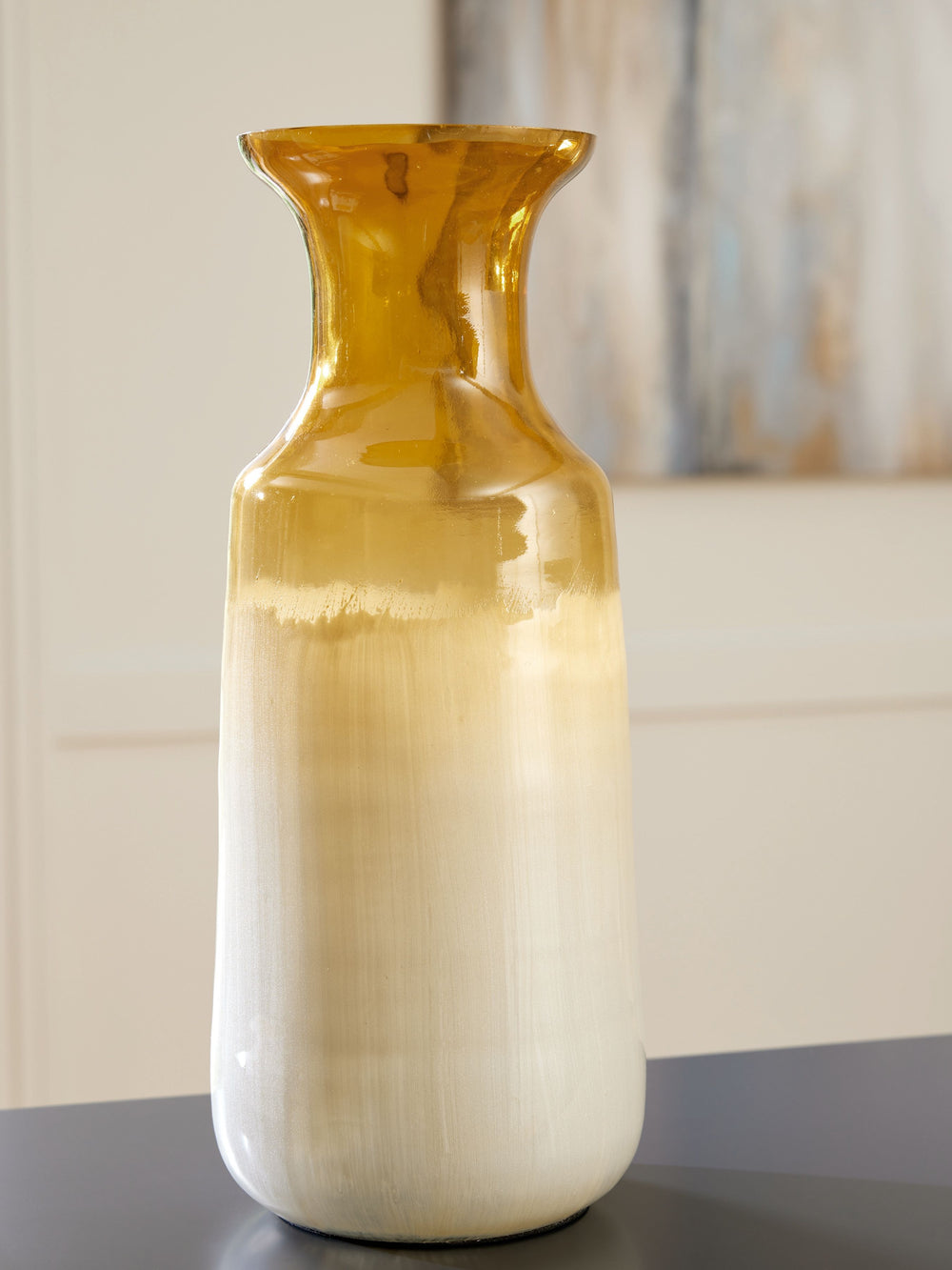 Mastering the art of simplicity, this contemporary vase in amber and white glass is enhanced with hand-painted ombre brushstrokes for a splash of color. The result? A stroke of genius.<br/><br/><b>Product Features</b><ul><li>Made of enamel glass</li><li>T