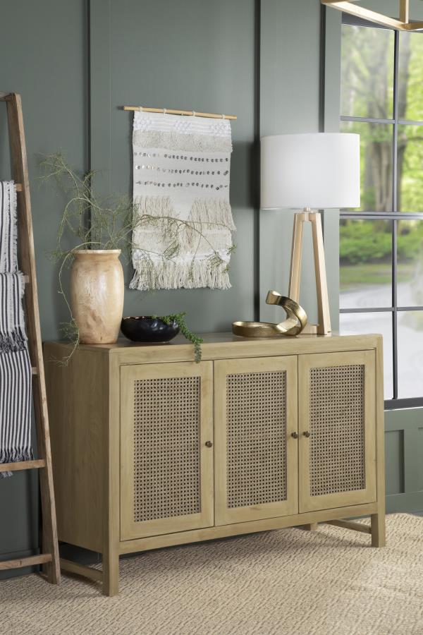  crafted from eco-friendly mango wood in a warm natural finish. The three cabinet doors feature woven cane panels