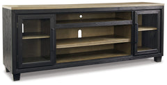 This TV stand with fireplace option is rustic, casual contemporary style simply done right. Its two-tone color scheme features a rich brushed black finish accented with a dusty grayish brown wood tone. With two glass-front cabinets (each with an adjustabl