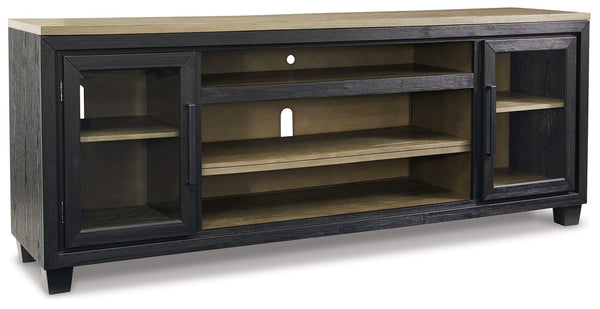 This TV stand with fireplace option is rustic, casual contemporary style simply done right. Its two-tone color scheme features a rich brushed black finish accented with a dusty grayish brown wood tone. With two glass-front cabinets (each with an adjustabl