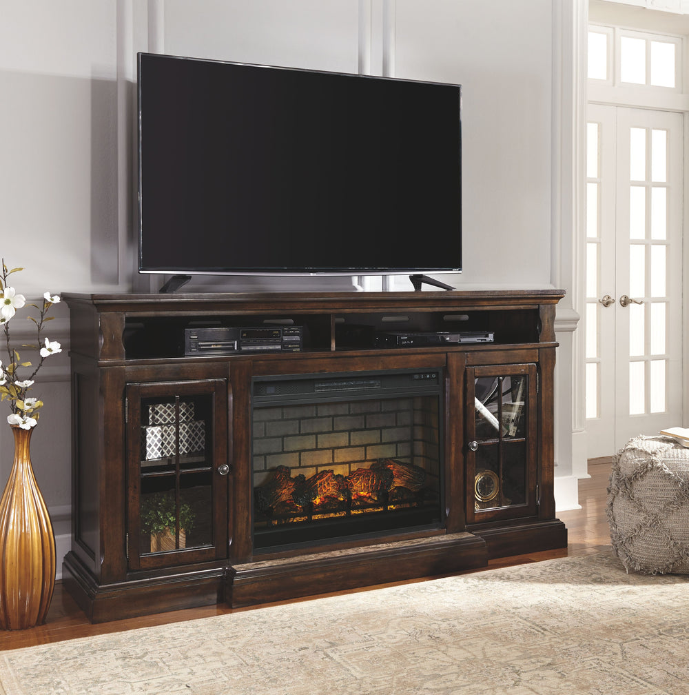 The beauty of this TV stand will immediately engage you. The slight breakfront shape is a rare find and an ideal fit among traditional and eclectic tastes. Soft black undertones highlight the warm finish. Multiple cubbies and glass-door enclosed shelves o