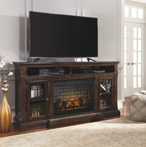 The beauty of this TV stand will immediately engage you. The slight breakfront shape is a rare find and an ideal fit among traditional and eclectic tastes. Soft black undertones highlight the warm finish. Multiple cubbies and glass-door enclosed shelves o