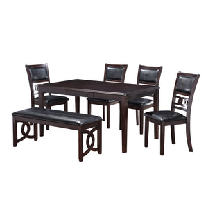 The New Classic Gia 6-Piece Wood Rectangle Dining Set is crafted from solid Rubberwood and Mindi veneers for a perfect blend of durability and aesthetic appeal. The dark ebony finish, achieved through a meticulous multistep process and clear coat, accentu