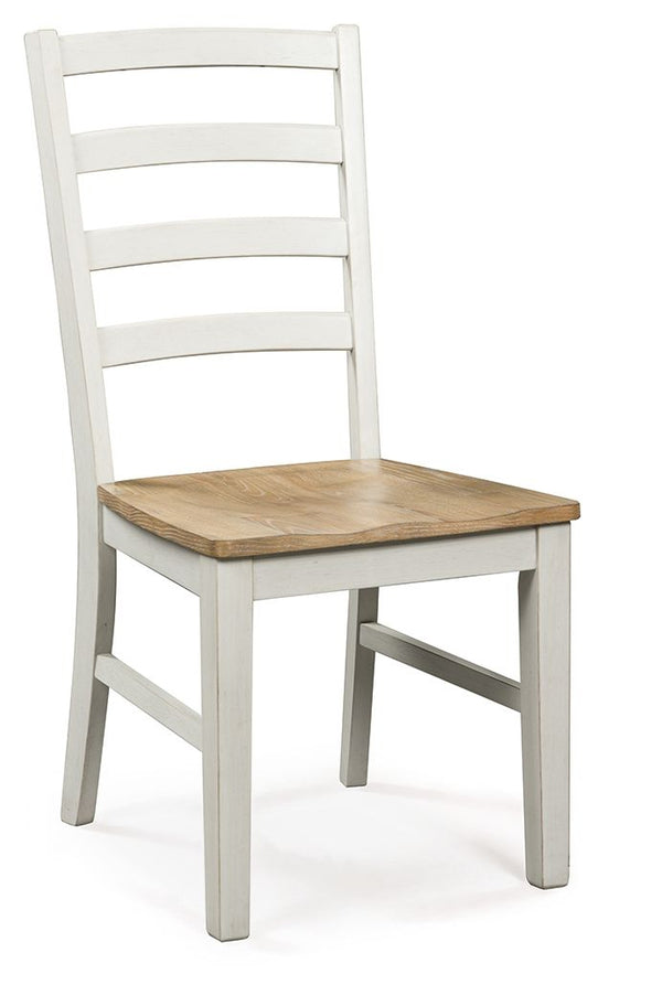 Busy breakfasts and family dinners get a dose of modern farmhouse flair with this dining chair. Its two-tone finish contrasts a light butcher block hue with an antiqued white frame for an utterly charming effect. A contoured seat elevates the comfort leve