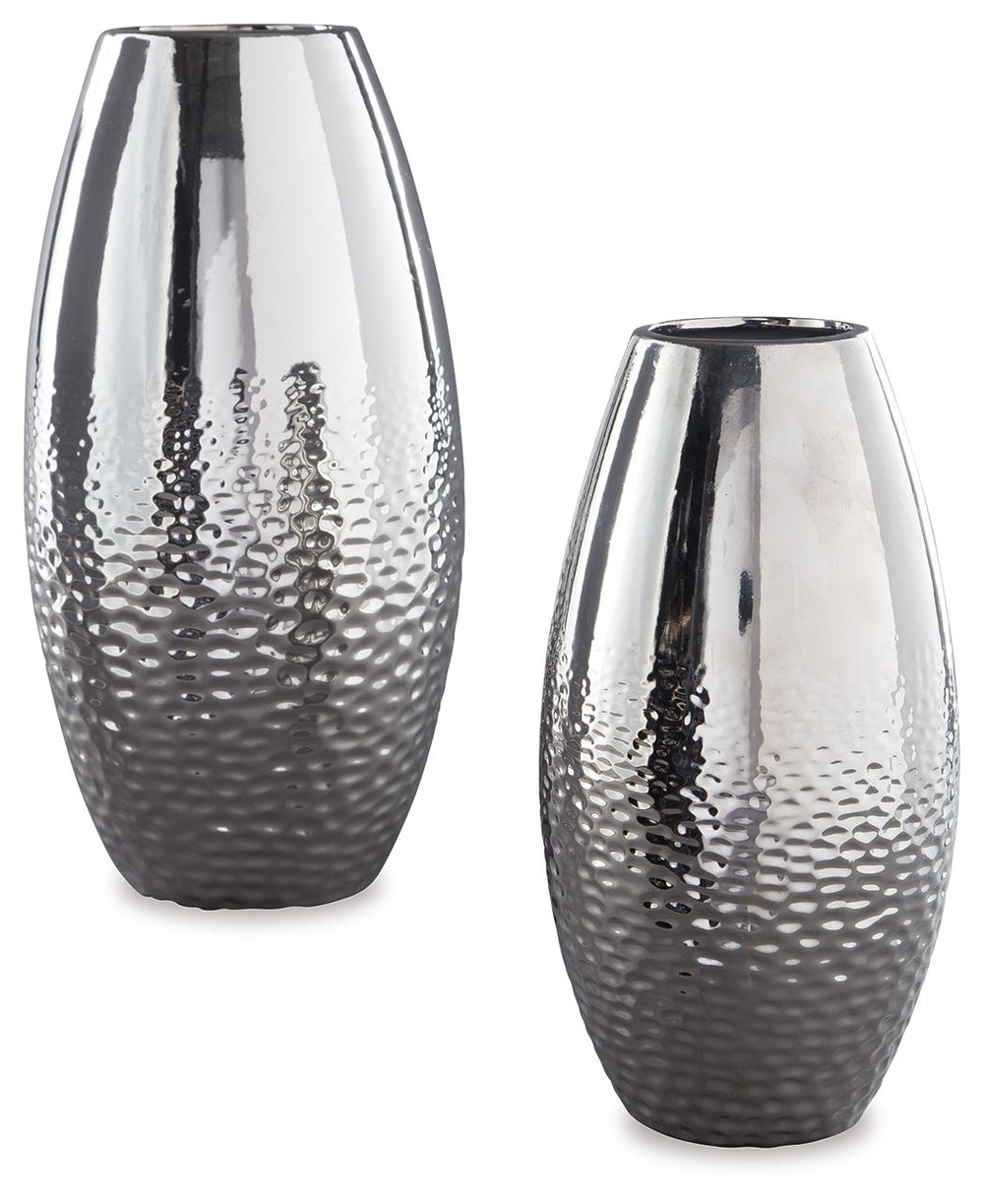 Add subtle glam with this ceramic vase set, reflecting your eclectic eye for design. The textural pattern gracing the sides of the vases evokes ripples of water. A spectacular silvertone glazed finish adds a splash of sheen and shine.<br><br><b>Additional