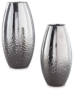 Add subtle glam with this ceramic vase set, reflecting your eclectic eye for design. The textural pattern gracing the sides of the vases evokes ripples of water. A spectacular silvertone glazed finish adds a splash of sheen and shine.<br><br><b>Additional