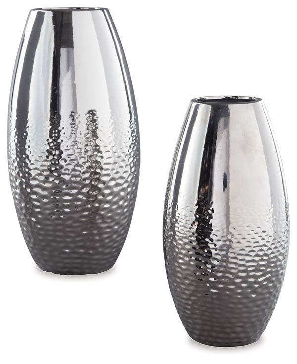Add subtle glam with this ceramic vase set, reflecting your eclectic eye for design. The textural pattern gracing the sides of the vases evokes ripples of water. A spectacular silvertone glazed finish adds a splash of sheen and shine.<br><br><b>Additional