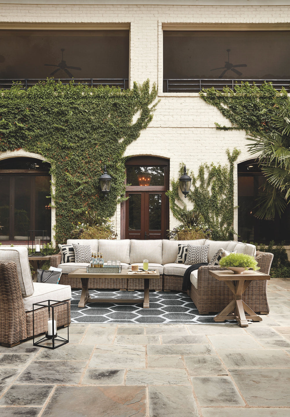For indoor or outdoor use. Cushioned resin wicker dining and modular seating. 4 throw pillows included with LAF/RAF loveseat. 2 throw pillows included with curved corner chair. Dining, cocktail and end tables have porcelain tops. Rust free aluminum frames