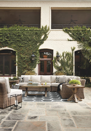 For indoor or outdoor use. Cushioned resin wicker dining and modular seating. 4 throw pillows included with LAF/RAF loveseat. 2 throw pillows included with curved corner chair. Dining, cocktail and end tables have porcelain tops. Rust free aluminum frames
