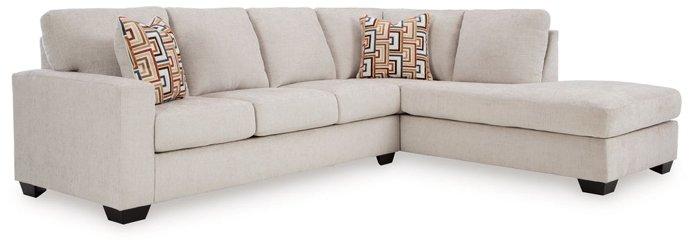 Looking to make a simply chic statement with color? Liven up your living room with this sectional with chaise. Its trend-right light neutral upholstery is a perfect blank canvas for adding pops of color. Bold and eclectic accent pillows complete the look.