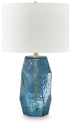 Clearly a contemporary choice, this striking table lamp wows with understated elegance. Its faceted blue glass base adds rich texture and a warm glow to a bedroom or living area, making it the perfect accent to brighten your home and make every moment shi