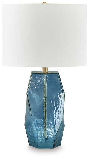 Clearly a contemporary choice, this striking table lamp wows with understated elegance. Its faceted blue glass base adds rich texture and a warm glow to a bedroom or living area, making it the perfect accent to brighten your home and make every moment shi