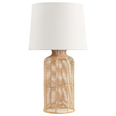 This table lamp seamlessly combines natural textures with modern elegance. Featuring a handcrafted rattan base in a cylindrical shape, it exudes a warm and organic appeal. The neutral fabric shade beautifully complements the rattan, softly diffusing light