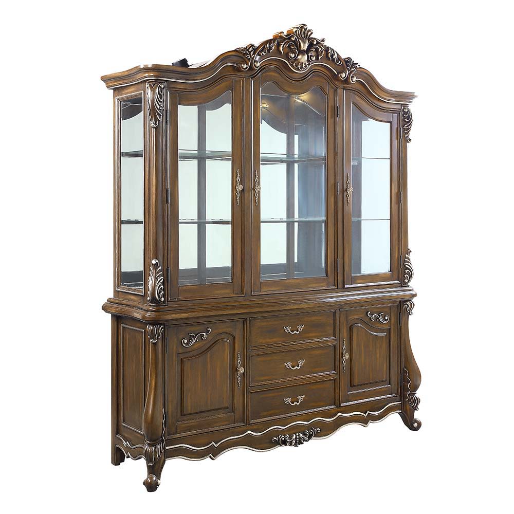 Traditional design with modern accents, the Latisha dining table is the perfect merging of contemporary and classic. The antique oak finish with the hand-brushed silver trim accentuates the elaborate floral moldings that are showcased throughout the legs 