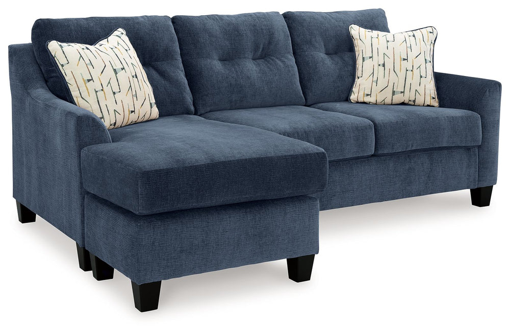 Urban contemporary meets mid century (with a pop of trend-right color) in this queen sofa chaise sleeper. Supremely soft upholstery, teeming with luster and movement, finesses the piece with just the right touch. Gently flared arms and tufted back cushion