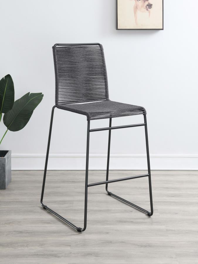 Create visual texture with this contemporary rope woven stool. A tall and slender metal frame in a gunmetal finish, wrapped in charcoal tone rope around the backrest and seat, offer a restful spot for family and guests at elevated dining areas. The metal 