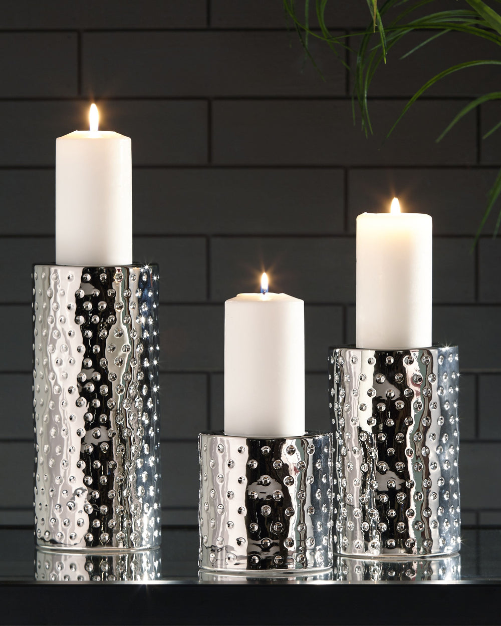 Take a stance for shapely style. Crafted of a glazed ceramic, this candle holder set shine with simply striking design and contemporary flair.<br><br><b>Additional Dimensions</b><br><ul><li>Candle holder-small: 0-"</li><li>Candle holder-medium: 0-"</li><l