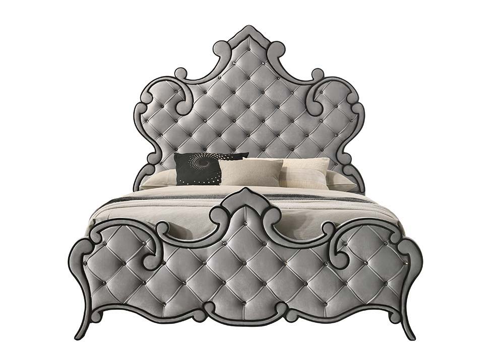 The Perine Collection is luxuriously designed and upholstered in sumptuous gray velvet and features black piping. The hardwood wooden frame is designed for long-lasting enjoyment. The crown design on the headboard and footboard adds some drama to the bed.