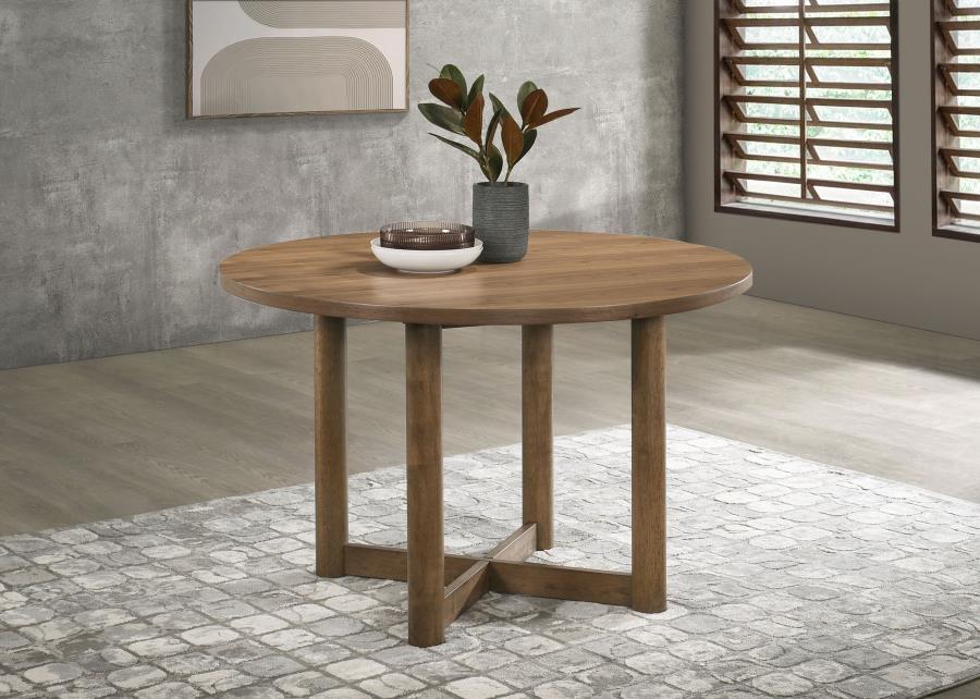 Embrace casual dining with the inviting ambiance of a modern round dining table. Crafted with a walnut finish over walnut veneer, it-'s a delightful centerpiece in a welcoming kitchen or dining room. Its round silhouette creates a unifying ambiance, perfe