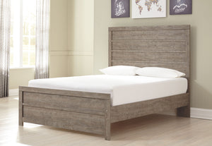 This full panel bedâ€™s weathered driftwood finish evokes such an ethereal vibeâ€”exactly what you need for a serene bedroom suite. Chunky moulding creates a plank-like effect while clean lines make for a timeless look youâ€™ll love living with for years 