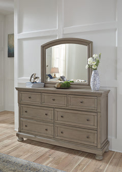 Satisfying your taste for tradition, this dresser and mirror set sports serene sophistication. Forever classic design detailsâ€”inlaid panels, silvertone patina hardware and bun feetâ€”are so easy to love. Seven roomy drawers keep your wardrobe organized 