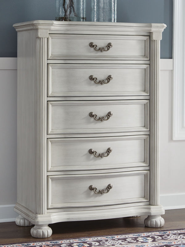  highlighted by a serpentine-shaped front with thick decorative moulding. Its drawer