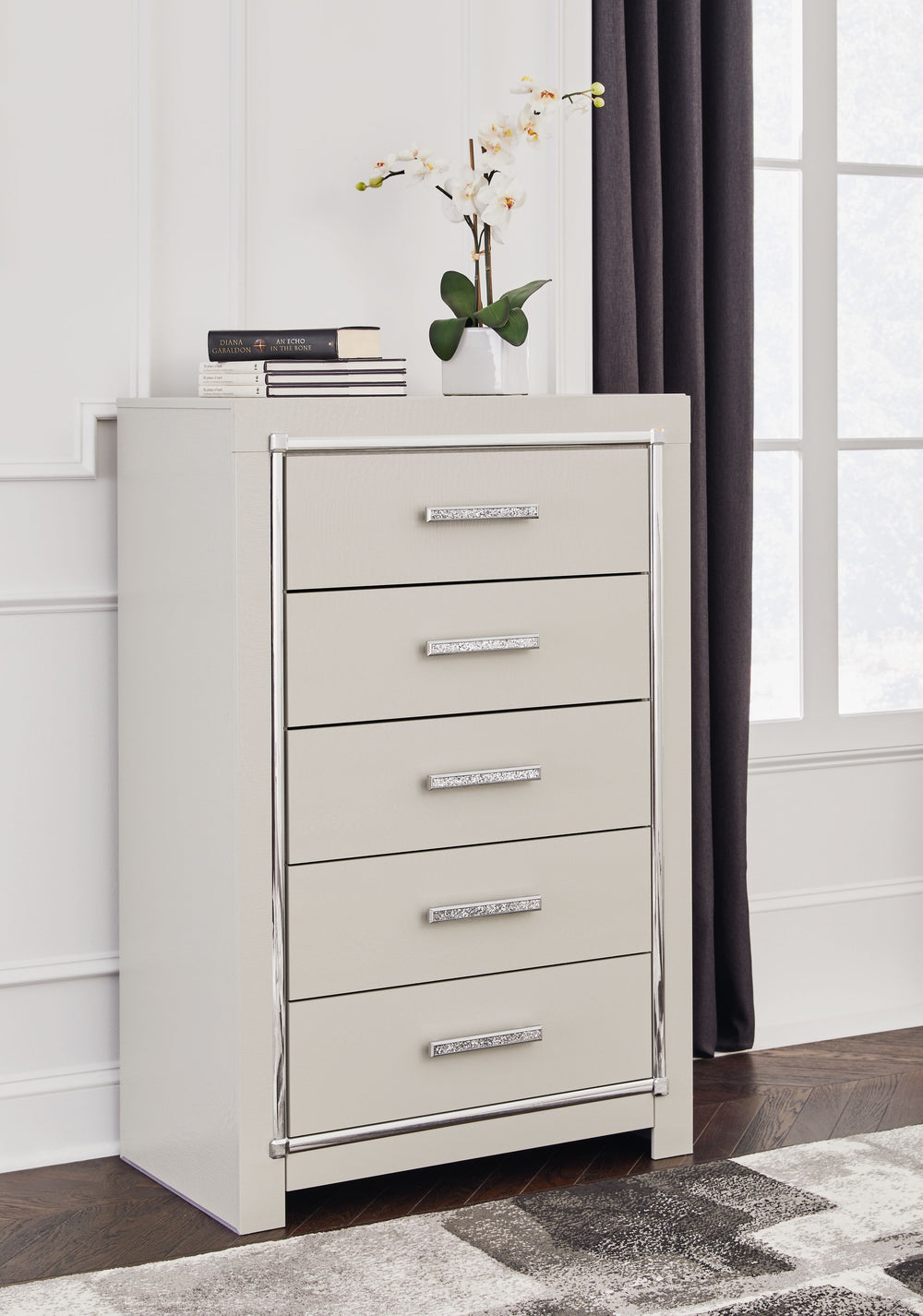 Bright, bold luxury. This chest of drawers dazzles with its attention to detail. Your love of glamorous style is reflected in its all-over faux gator in a metallic finish, exquisitely paired with faceted chrome-tone details. Complete with smooth-gliding s