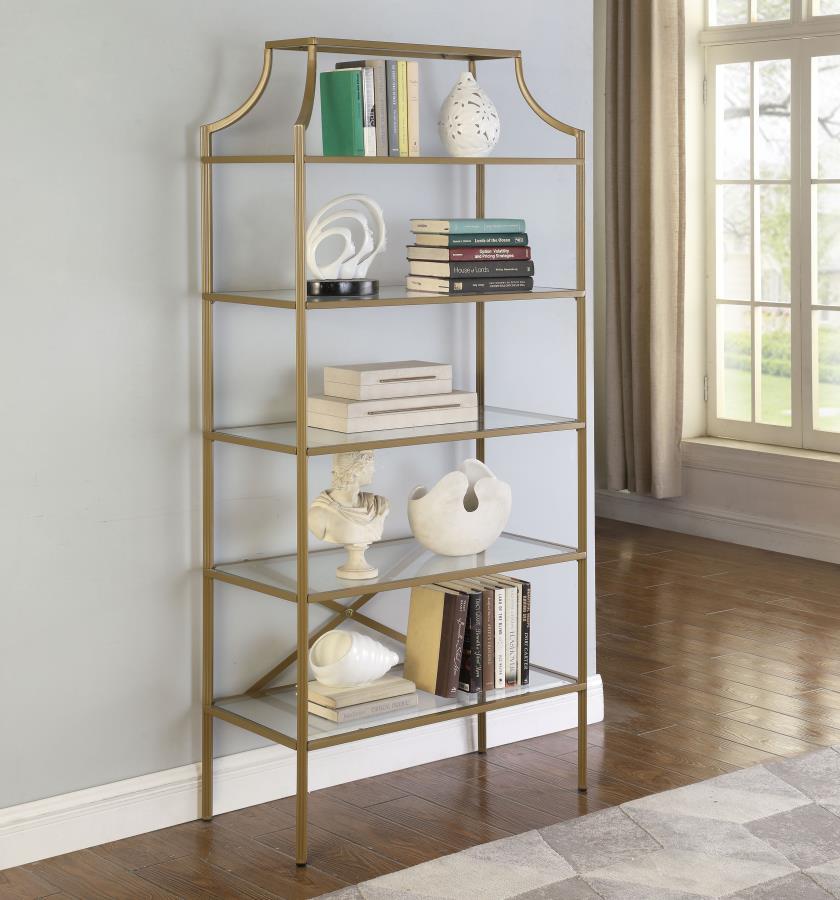 A call for strength and style gets answered by this bookcase. Contemporary style allows for easy placement within your space. The stylish metal frame in gold creates conversation. Enjoy durability as all glass elements are tempered. Updated unit boasts fi