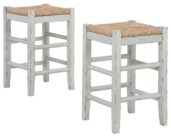 Bring the vintage casual vibe you love to the kitchen with this counter height bar stool. A stylish seating solution in a white rubbed-through finish, this charming stool completes your dining space with ease. The woven seagrass seat and wood stretchers c