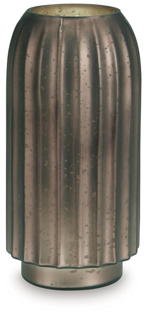 If contemporary style speaks to your design sensibilities, this vase will captivate you with its on-point aesthetics. A stunning mercury glass finish and fluted design make it a visual delight. This exquisite piece effortlessly stands out on its own, or y