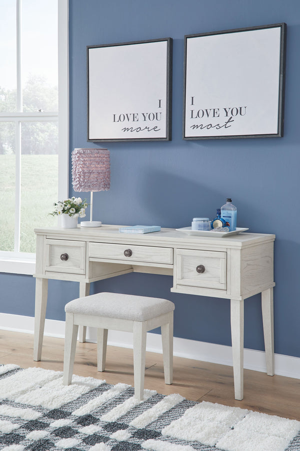 Elegant, timeless furnishings take your bedroom to the next level. Nothing does that better than this vanity and stool set. The antiqued white finish with a wonderful grain texture radiates sophistication, while dark bronze-tone knobs add an ornate touch.