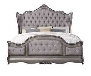  featuring intricate carvings that embody the period. The wingback headboard is a classic design is accented with crystal-l