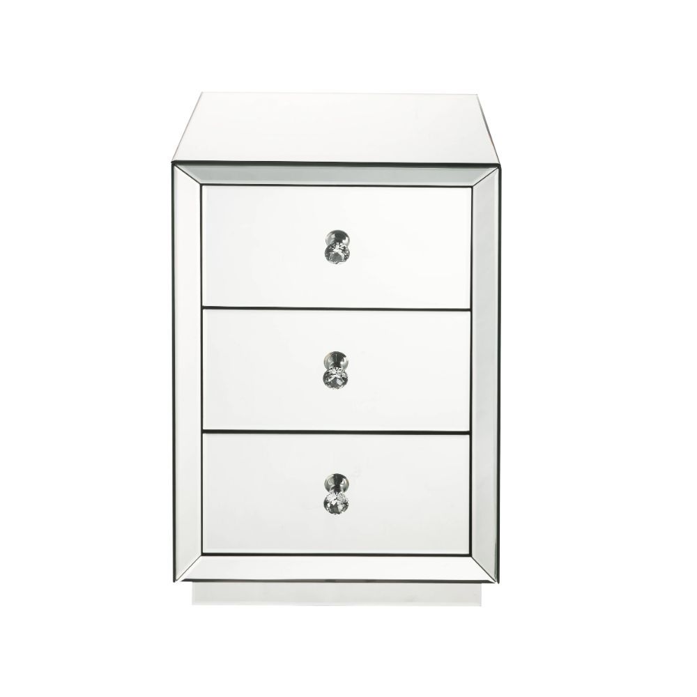 The Nyoka occasional table is perfect for your modern grace bedside. This dazzling table features a sturdy wood frame fully lined in beveled mirrors that will reflect light and your bold beauty. Its three drawers boast crystal knobs and are right size for