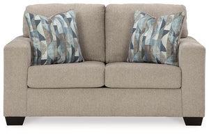  and the wide track arms are eager to support your quest for total relaxation. Distressed abstract toss pillows bring a fresh breath of contemporary 