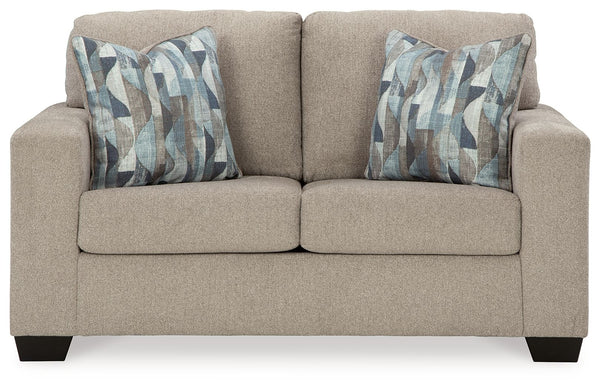  and the wide track arms are eager to support your quest for total relaxation. Distressed abstract toss pillows bring a fresh breath of contemporary 