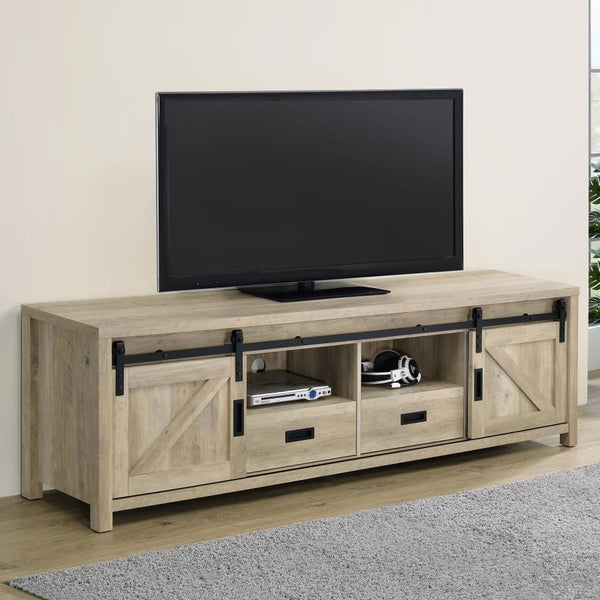  a stereo and more tucked neatly within two open shelves toward the center. Disguised by sliding barn doors mounted on black hardware that le