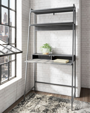  the minimalistic desk provides a convenient work surface with incorporated cubby shelves (with cutout for wire