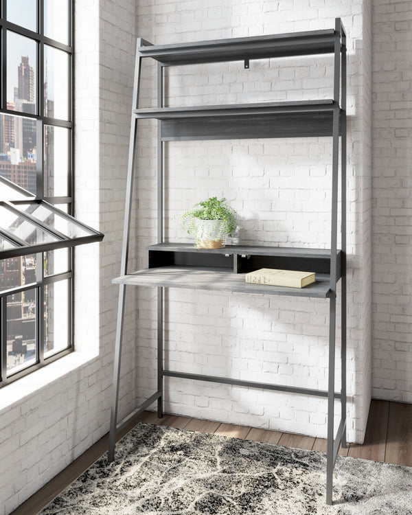  the minimalistic desk provides a convenient work surface with incorporated cubby shelves (with cutout for wire