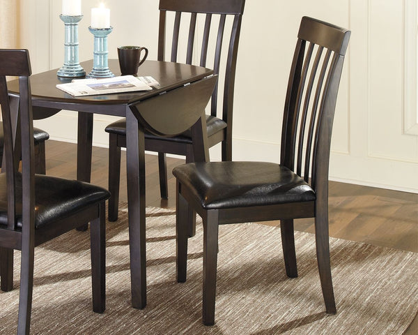 If contemporary tantalizes your taste buds, savor the beauty of this sleek upholstered dining room side chair. Rake back design complements an open and airy aesthetic. Dark and dramatic finish makes a bold, beautiful statement.<br><br><b>Additional Dimens