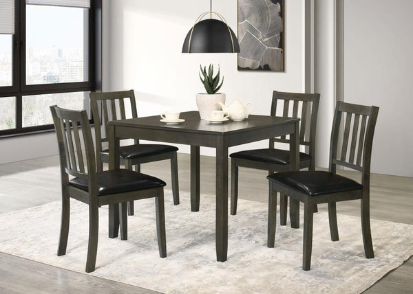 Perfectly sized for a breakfast nook or compact dining room, this contemporary five-piece dining set offers inviting style and a compact profile. The set centers on a square dining table crafted of wood with okume veneer in a stylish, neutral finish. Four