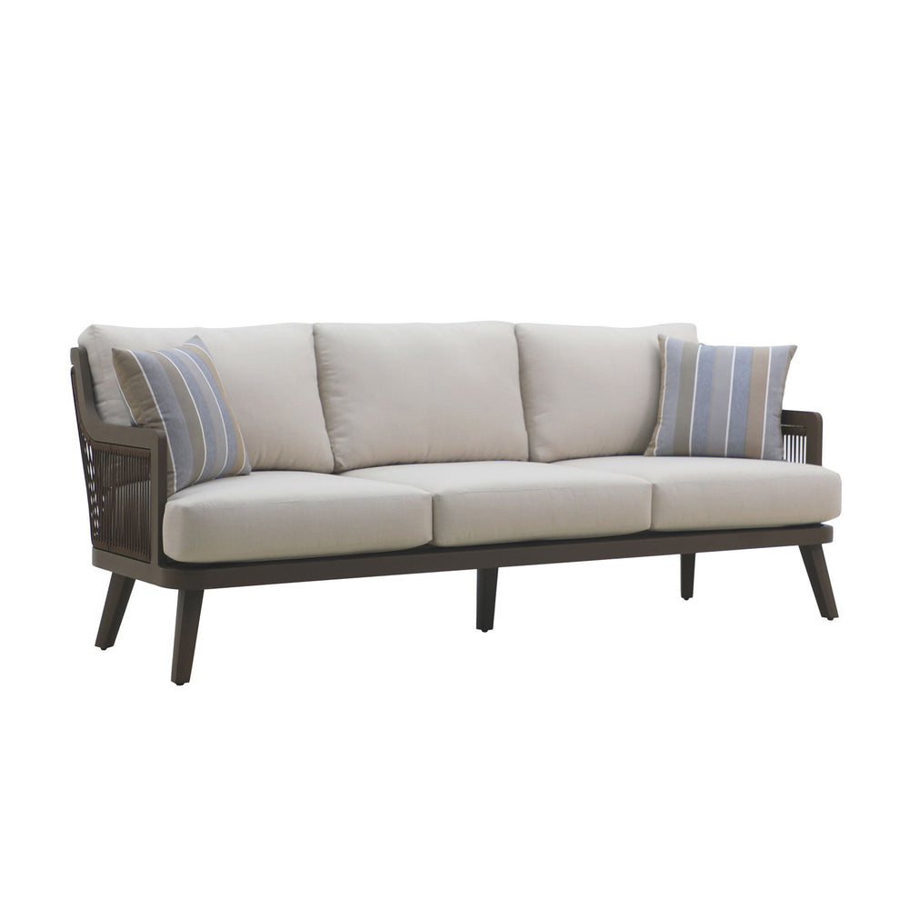 The Genova Patio Sofa with two accent pillows offers a perfect blend of durability, comfort, and style for your outdoor living space. Built with a strong aluminum frame and a baked-on powder coat, this sofa is designed to withstand scratches and ensure lo
