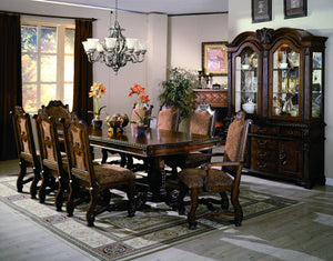 Elevate your dining space with the timeless elegance and grandeur of this exquisitely crafted dining group. Featuring a beautifully carved table with intricate detailing and a stately double pedestal base, this set exudes classic European-inspired charm. 