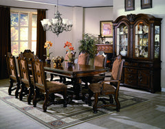 Elevate your dining space with the timeless elegance and grandeur of this exquisitely crafted dining group. Featuring a beautifully carved table with intricate detailing and a stately double pedestal base, this set exudes classic European-inspired charm. 