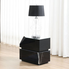 This Drisana exudes modern elegance with its rectangular coffee and end tables. Featuring a sleek black mirrored surface and a sophisticated marble grain design, these tables bring a touch of luxury to any living space. The unique combination of reflectiv