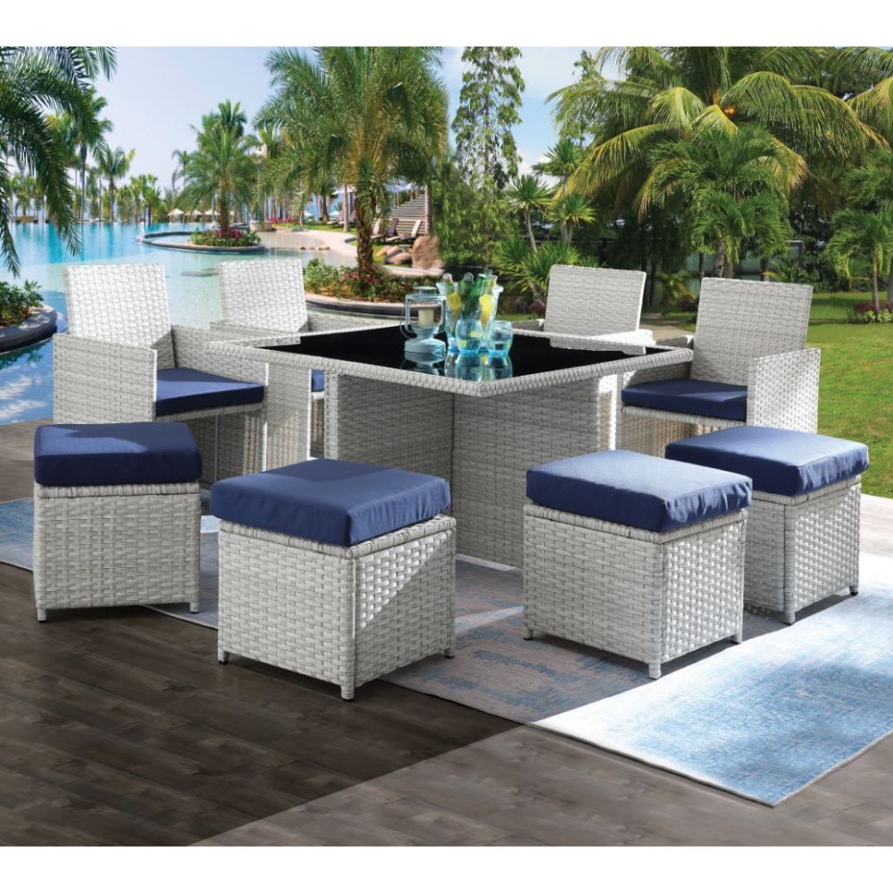 Create some lovely flow and dazzling style on your patio or balcony with this beautiful patio set. This unique blue fabric and wicker set features a cocktail table with glass top, 4 chairs and four backless cubes with fabric cushions. This marvelous and s