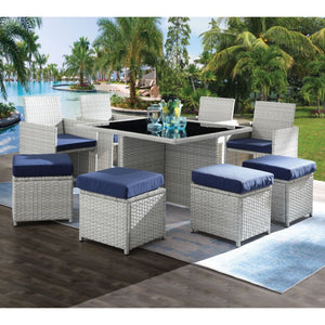Create some lovely flow and dazzling style on your patio or balcony with this beautiful patio set. This unique blue fabric and wicker set features a cocktail table with glass top, 4 chairs and four backless cubes with fabric cushions. This marvelous and s