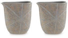 This vase is exquisitely designed with artisanal appeal and a starburst pattern. A unique mix of primitive and modern, it displays a wide mouth to hold your most bountiful bouquets. The intriguing silhouette captures the eye, complementing a room craving 