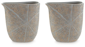 This vase is exquisitely designed with artisanal appeal and a starburst pattern. A unique mix of primitive and modern, it displays a wide mouth to hold your most bountiful bouquets. The intriguing silhouette captures the eye, complementing a room craving 