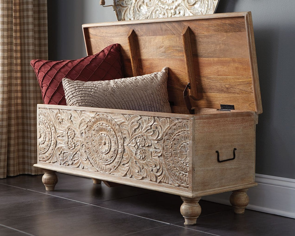 Merging practical storage with an exotic sense of flair, this storage bench stands out from the crowd in an intriguing way. Its grainy wood is beautified with an antique white finish, and the ornamental medallion carvings are pure artistry.<br><br><b>Addi