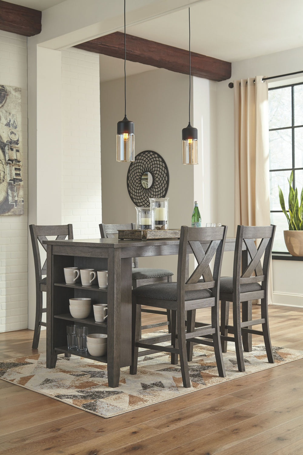 Casual lifestyle design constructed with Acacia veneer and solids. Finished in an antiqued gray wash color. X-back chairs feature solid wood frame and cushioned seat covered with a gray textured polyester fabric with nail head trim. Matching backless benc
